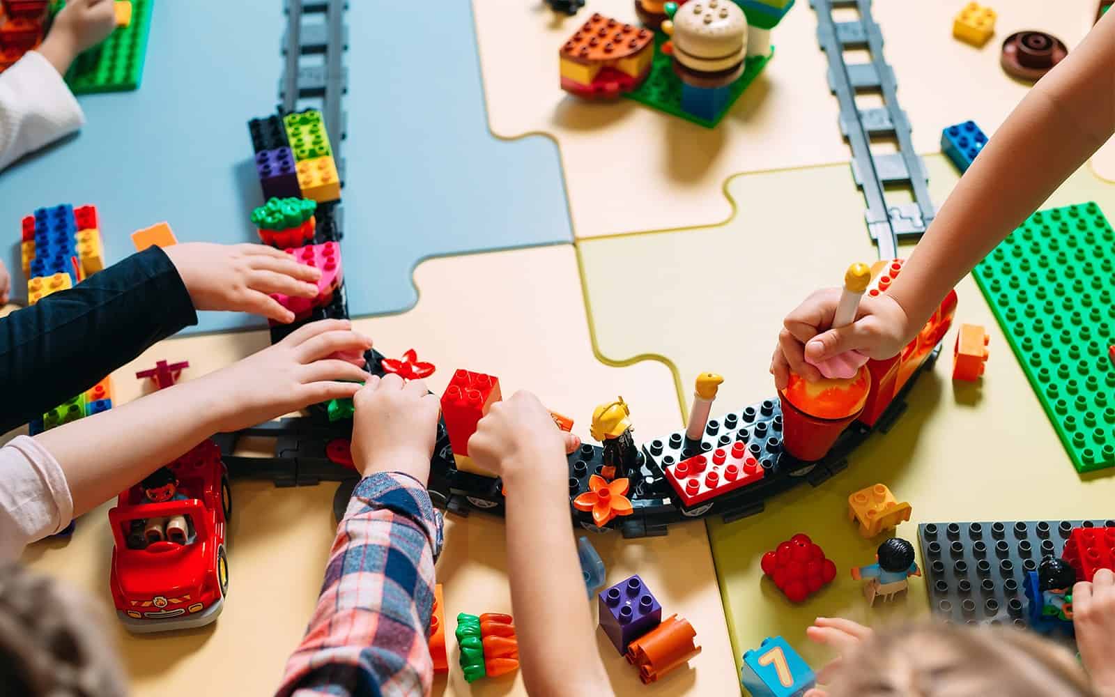 Children playing with Lego train