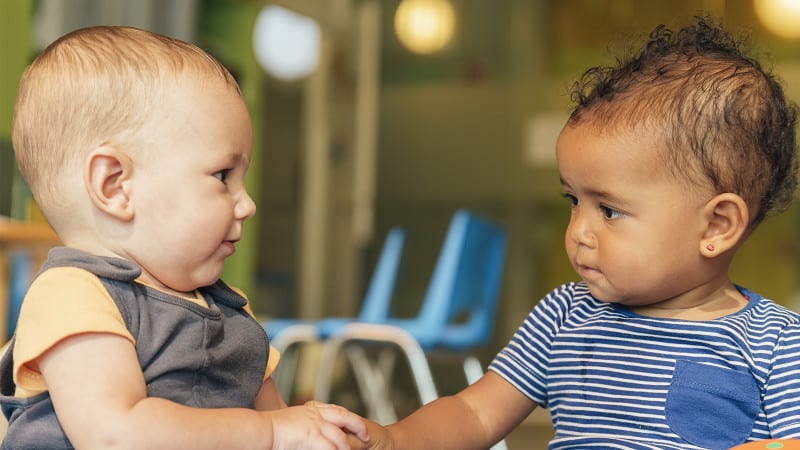 Two babies playing together