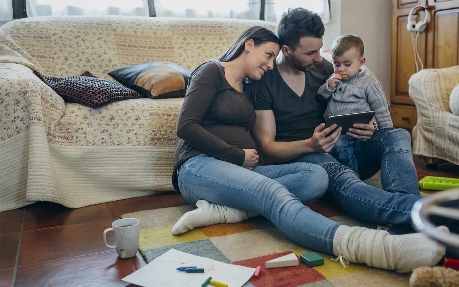 Parents teaching child at home