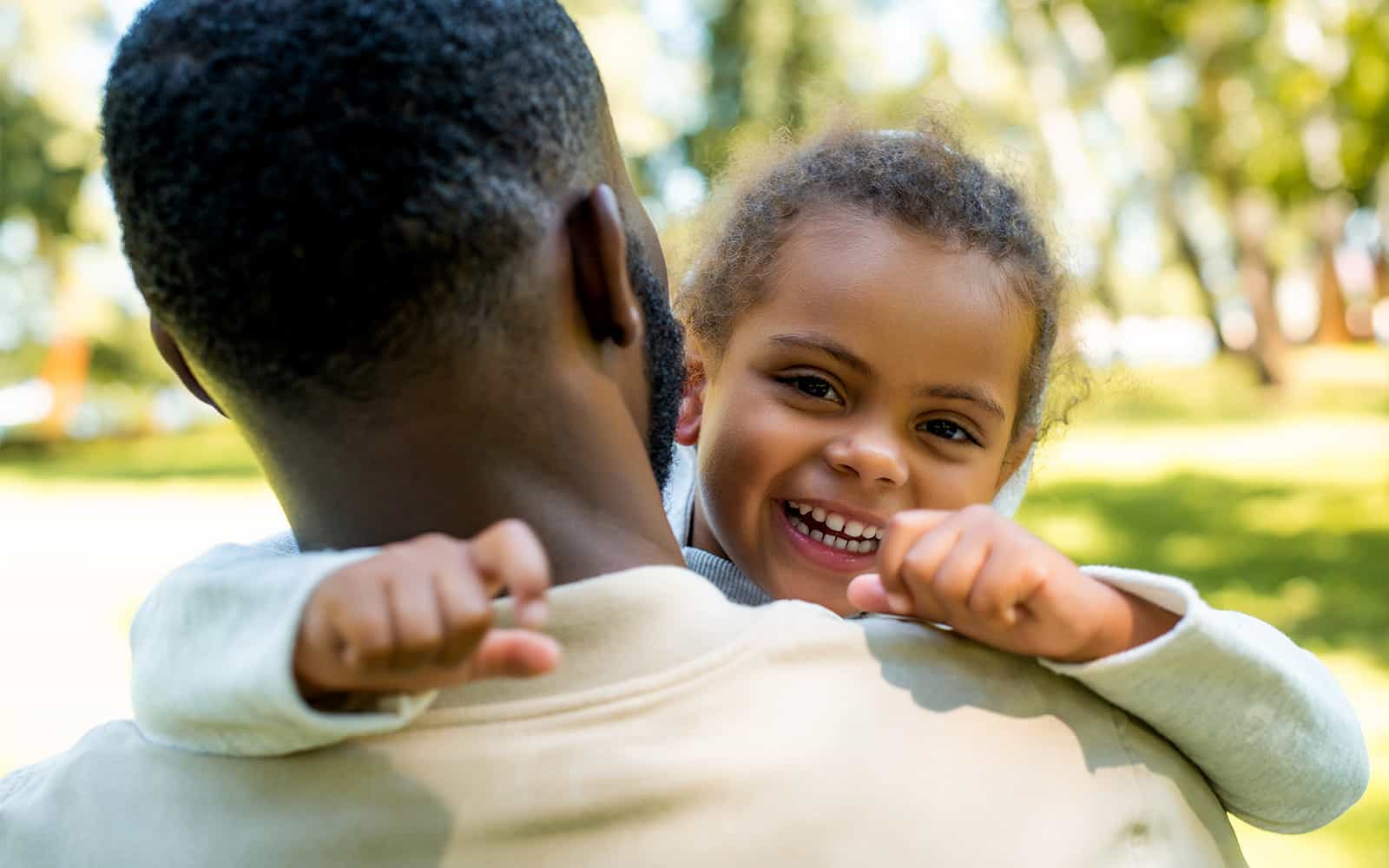 Father holding young child