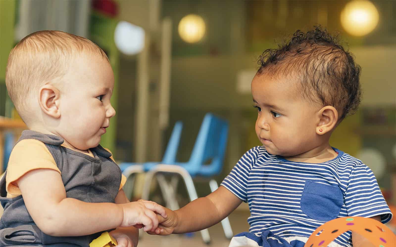 Two babies playing together at day care