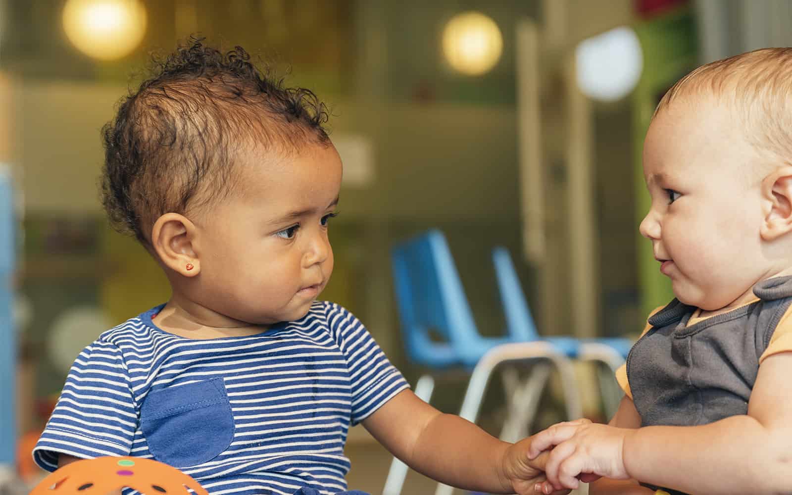 Two young children playing at day care