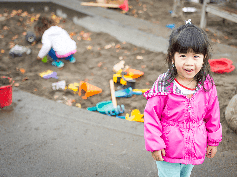 Girl in pink coat