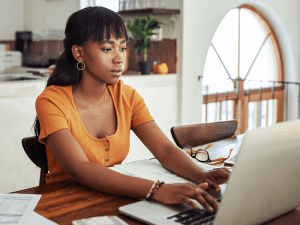 Young woman at her laptop working