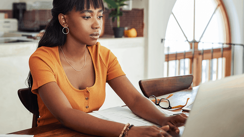 Young woman at her laptop working