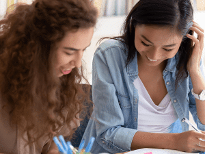 Two women working together