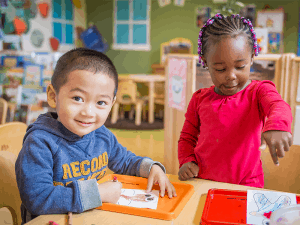 two children coloring together