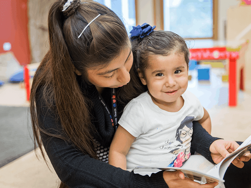 Young child and teacher