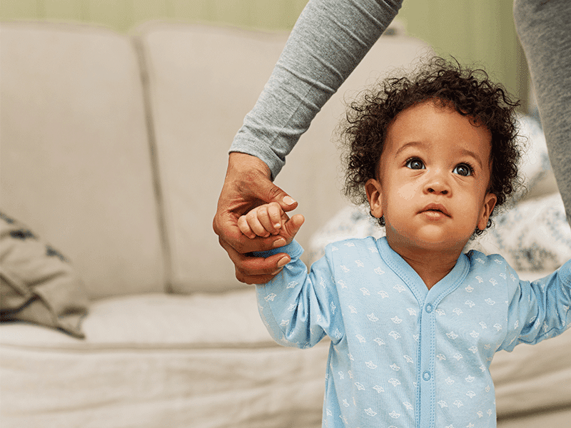 Baby walking with help