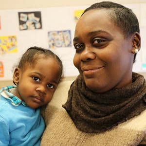 Early Childhood Hero Zeporah Askia and her child