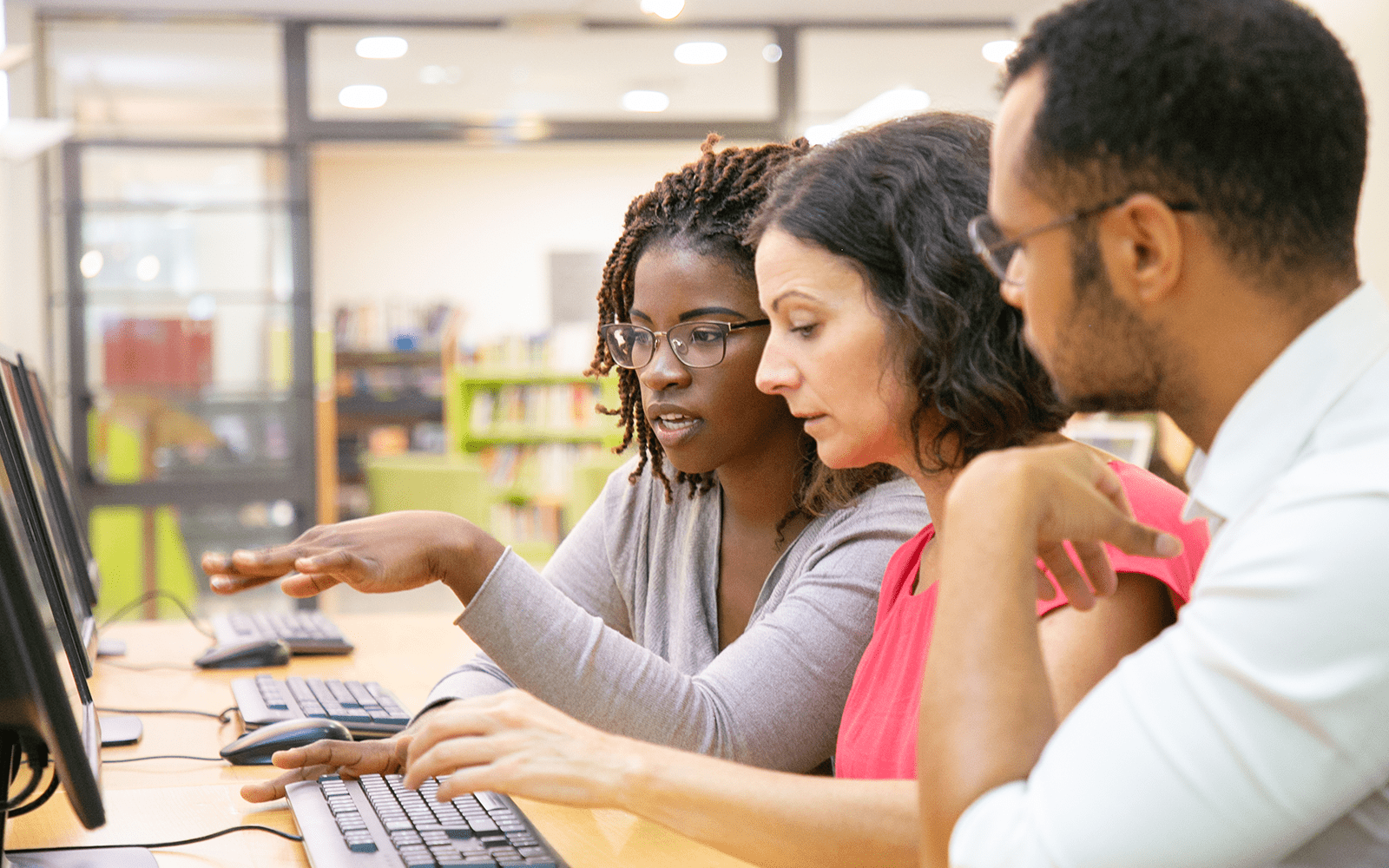 Professionals around a computer