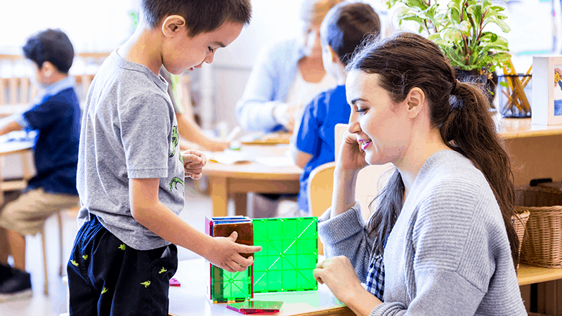 Teacher building with student