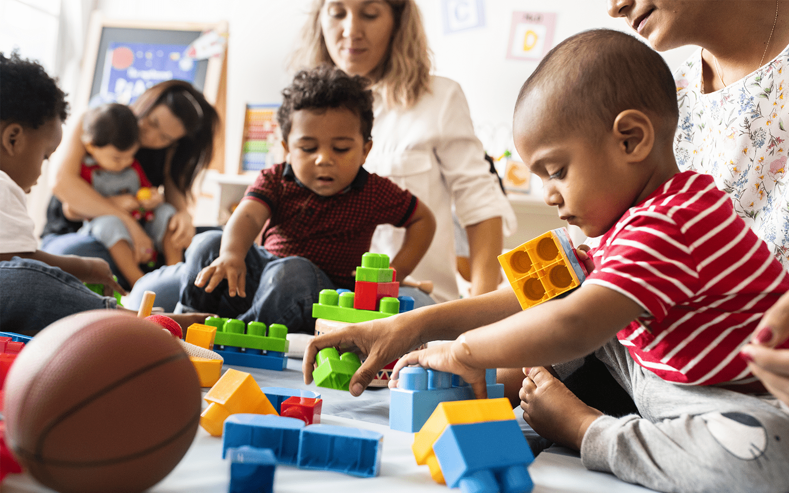 Play ground with toddlers and parents playing together