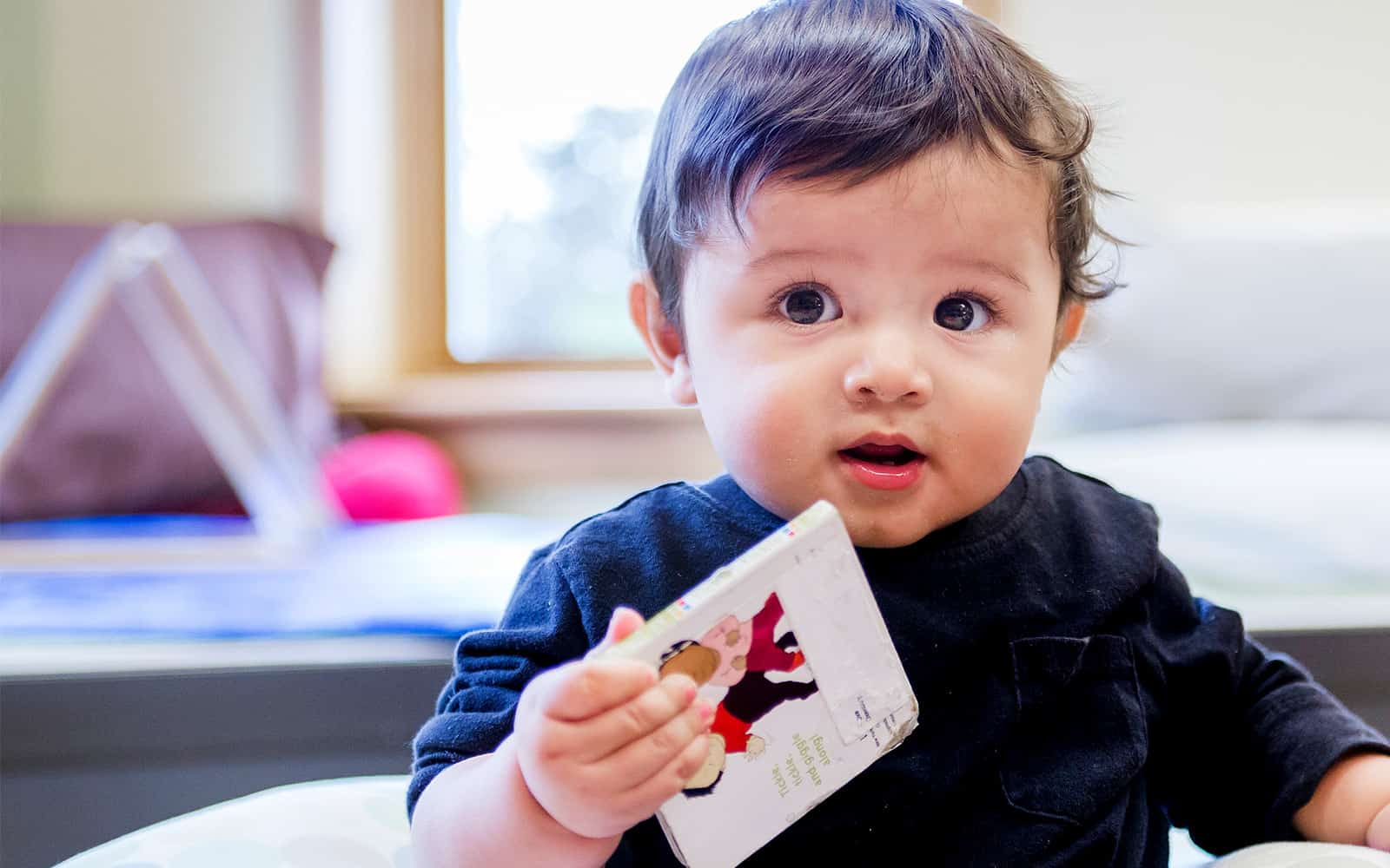 Young child holding book