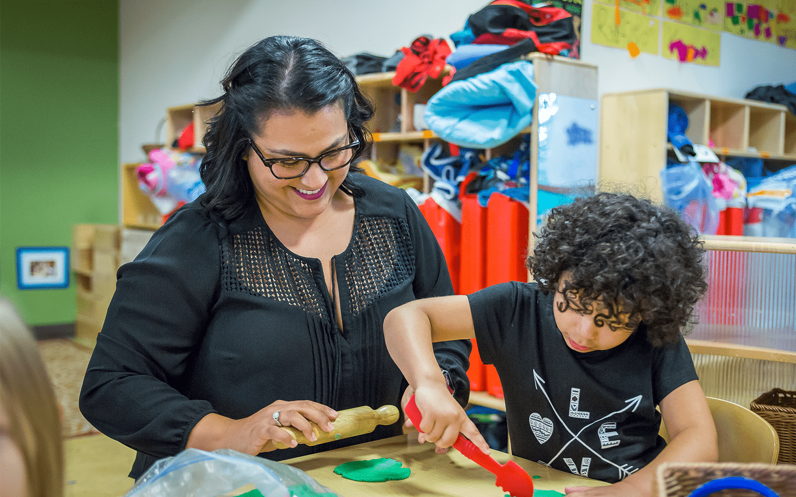 Child in Classroom With Teacher