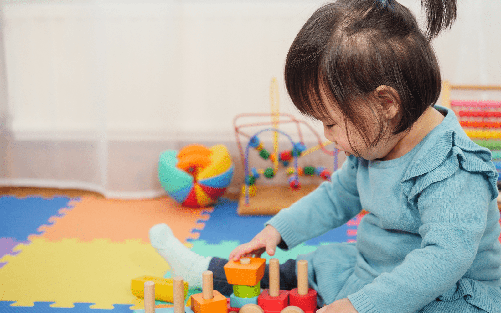 Little Girl Plays With Blocks