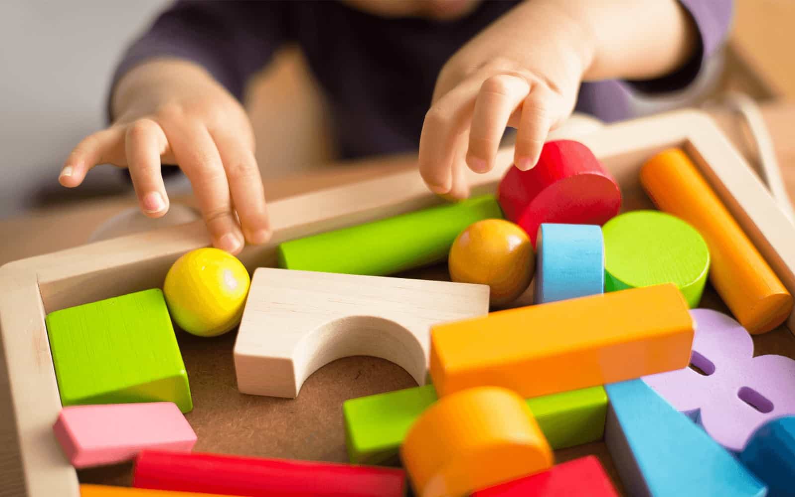 Child's hands with blocks