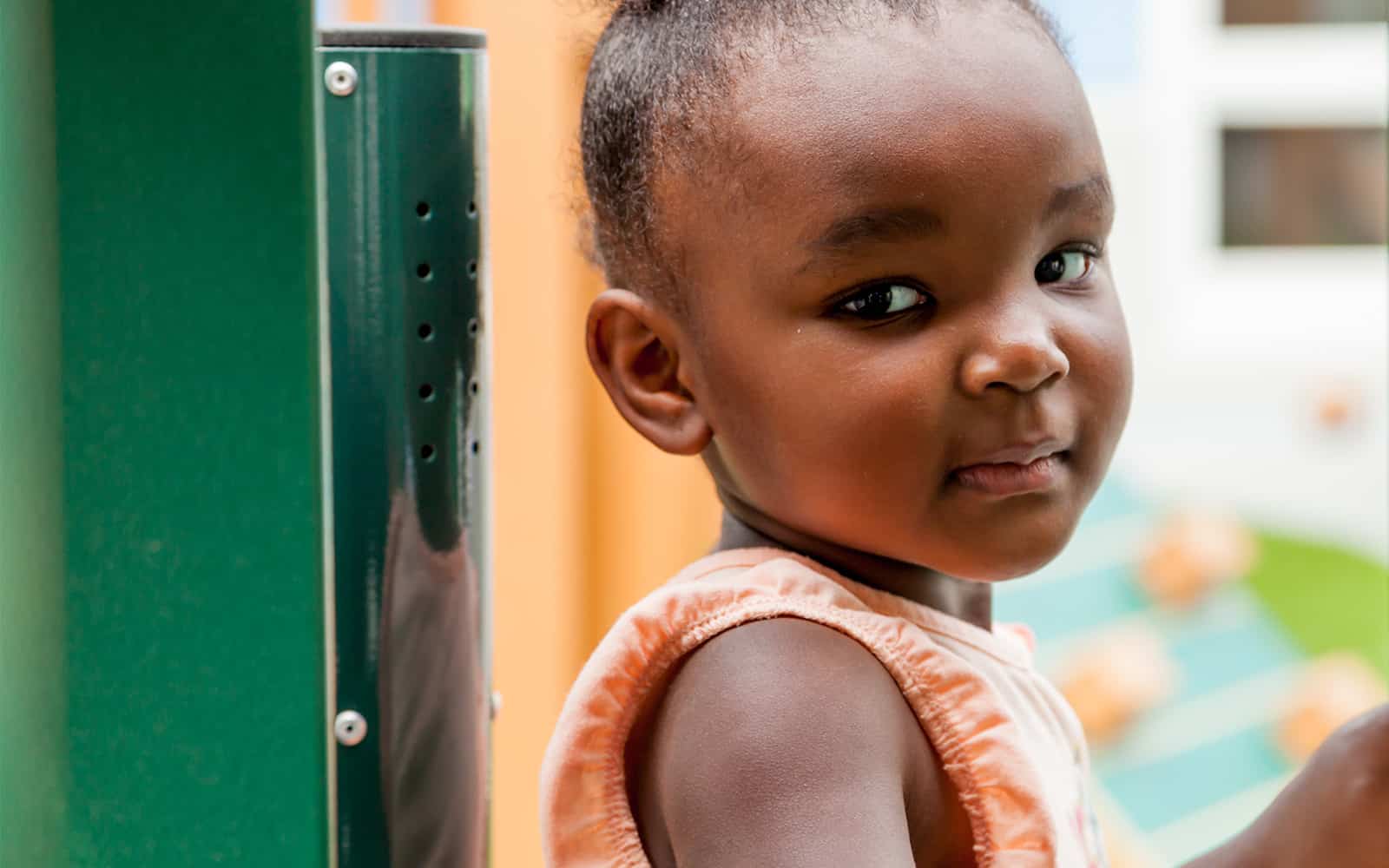 Child looking at camera in playground