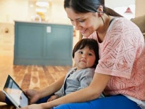 Mother and child engaging with technology