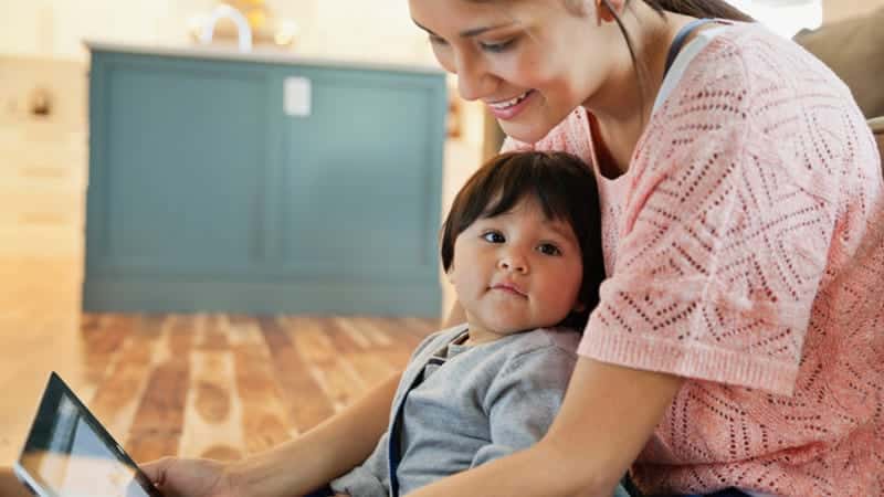 Mother and child engaging with technology