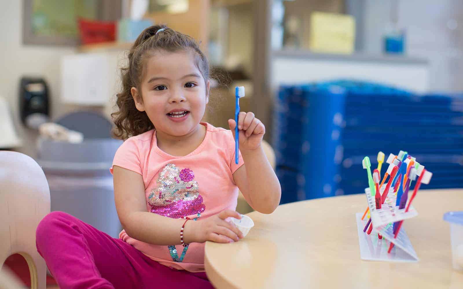 Girl with toothbrush