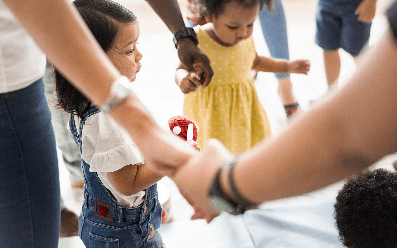 Children and teachers in a circle