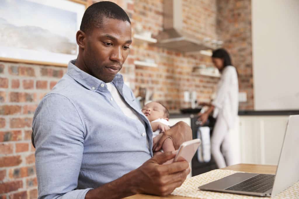 Father researching on phone