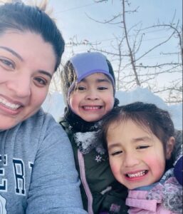 Gaby sledding with her nieces (Jan. 2022)