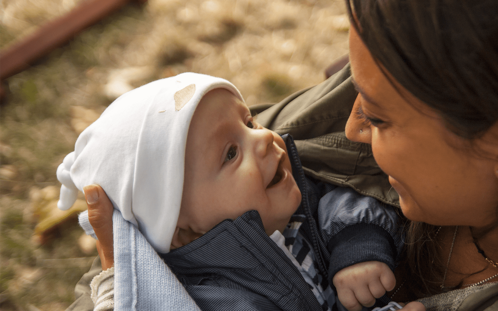 Baby smiling at care giver