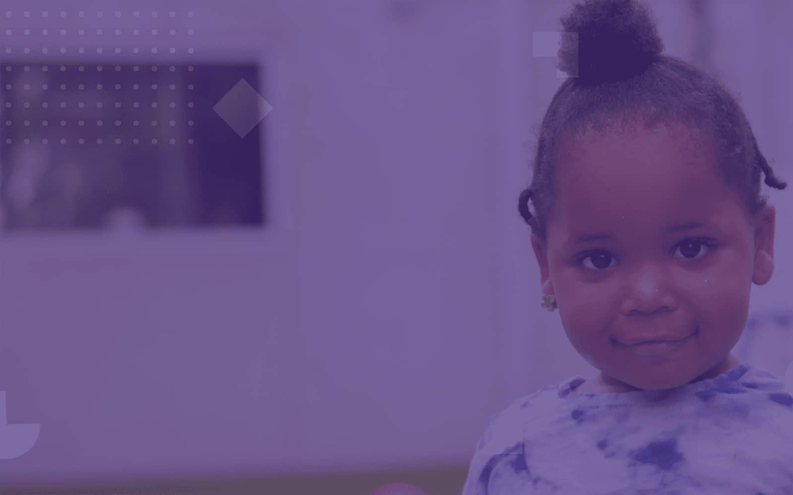 Little girl smiling with light purple overlay