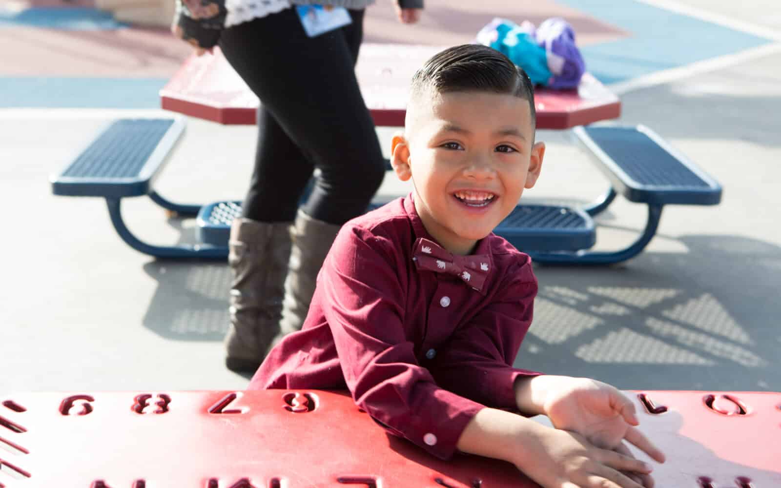 Little boy looking at camera and smiling