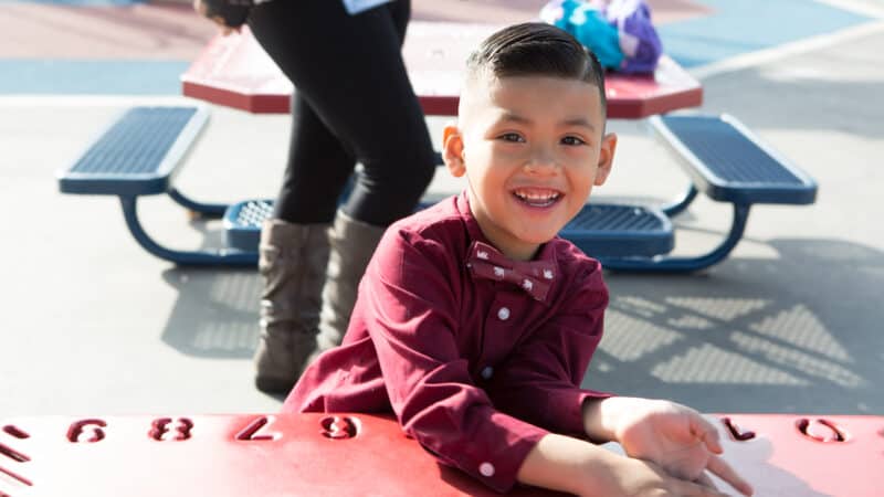 Little boy looking at camera and smiling