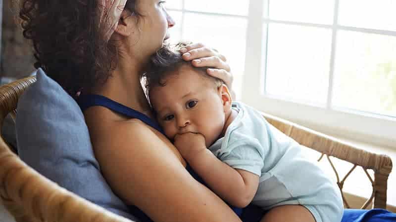 Caregiver holding baby