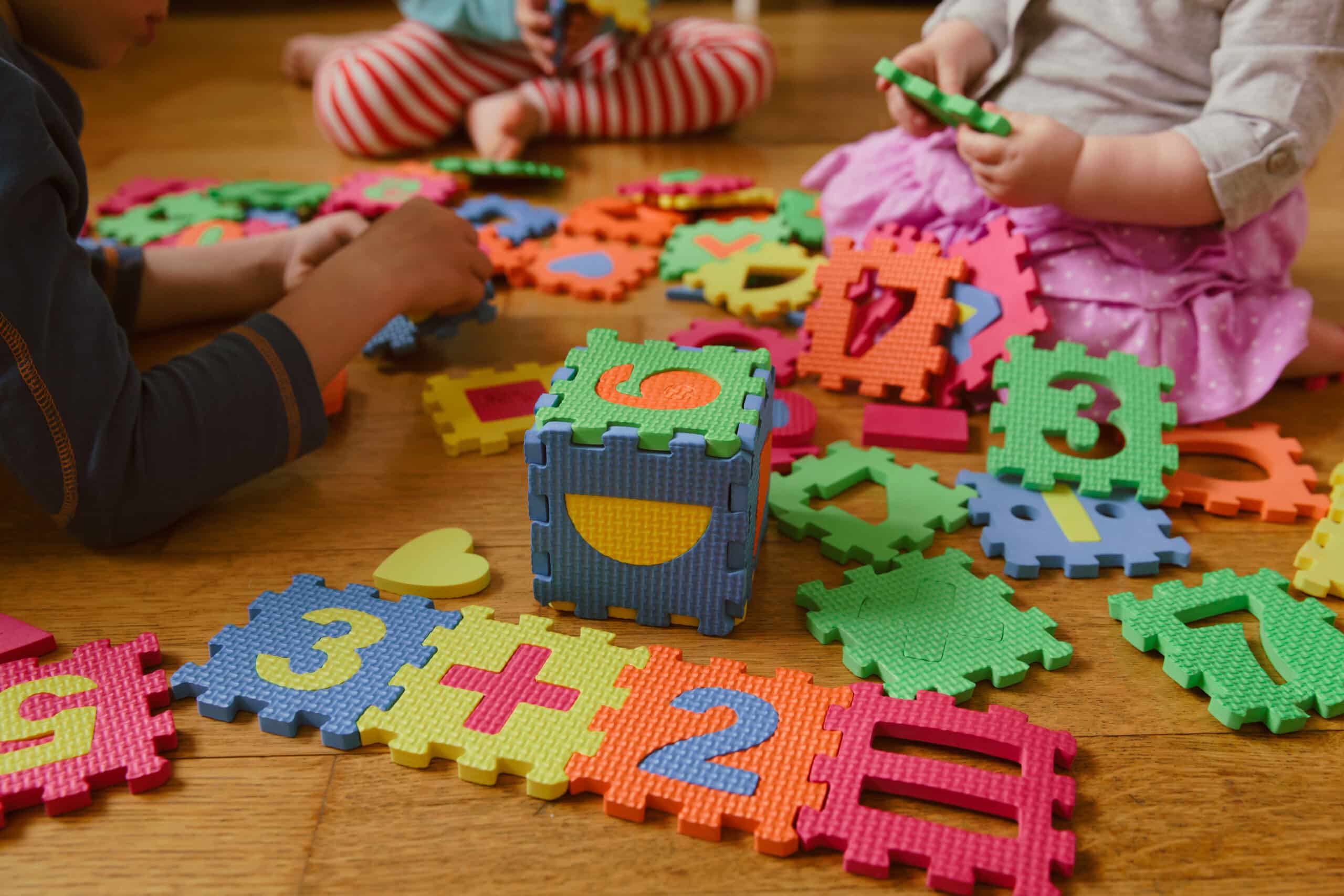 kids playing with number puzzle