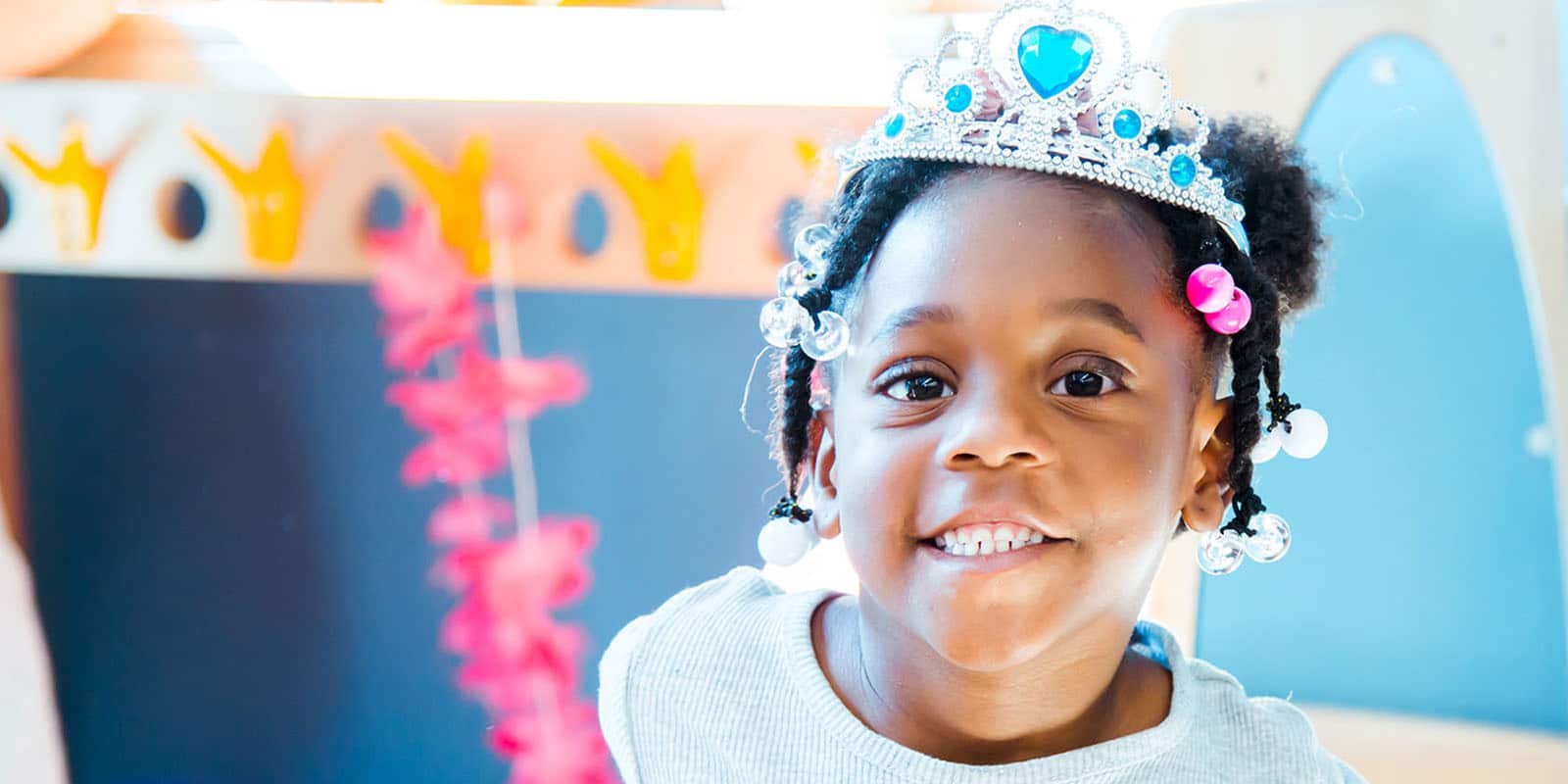 Young child wearing tiara