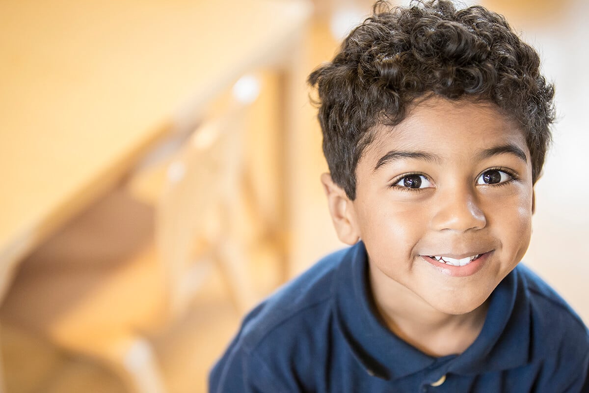 Child Smiling at Child Care Center