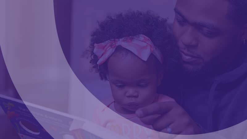 Dad and daughter reading a story