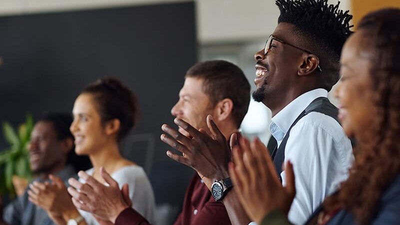 Professionals applauding speaker