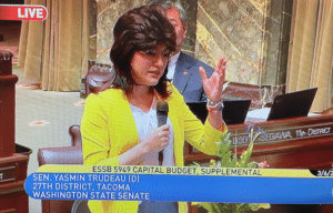 Sen. Yasmin wearing a mullet speaking on ESSB 5949 supplemental capital budget 