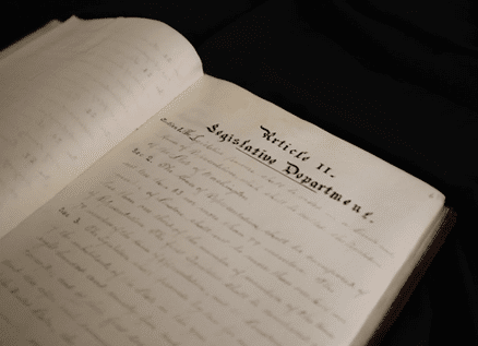 WA State Constitution open on the Article II page 