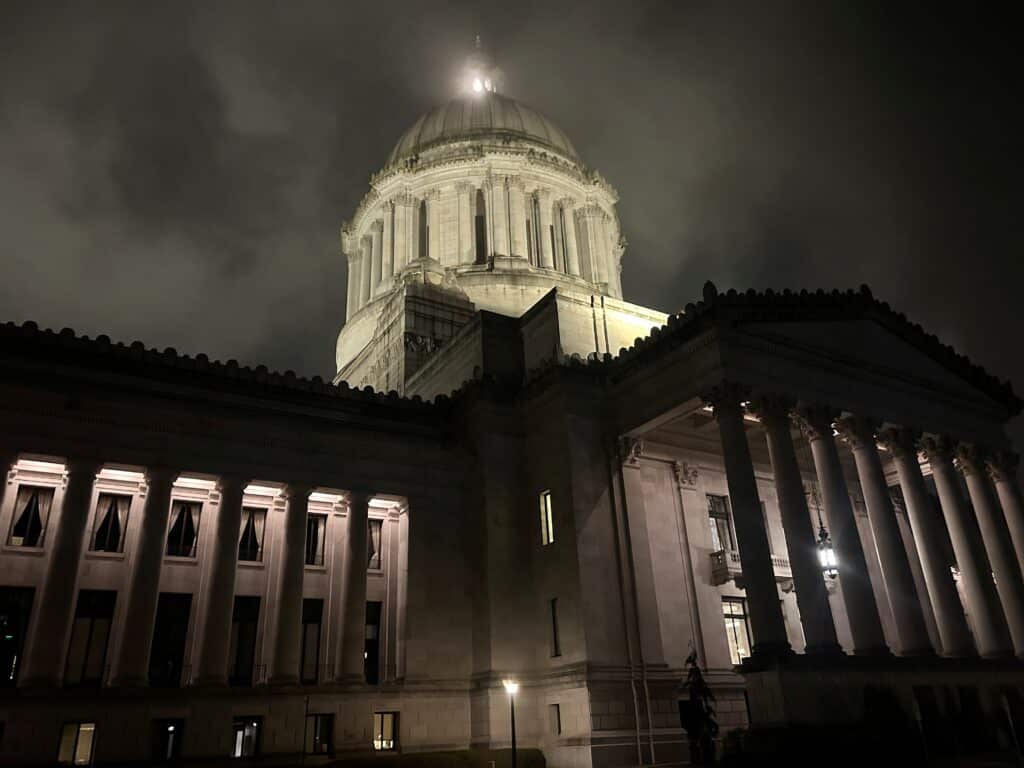 Photo of the Capitol Building in Olympia, Washington, shot from the side, in the early morning before the sunrise from March 2025.