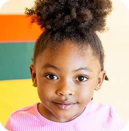 Young child smiling at camera