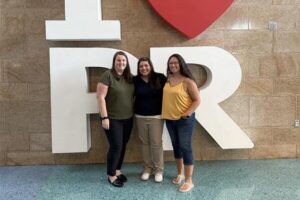Start Early Washington Team members in front of I Love Puerto Rico sign at the 2025 Parents as Teachers Conference