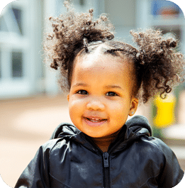 Young child playing outside at Educare Chicago