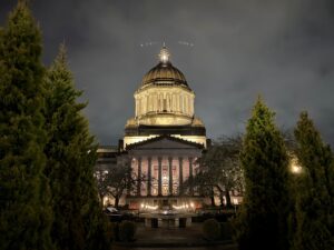 The south-facing entrance of the WA State Legislative Building at night during the 2nd week of the 2026 WA State Legislative Session.