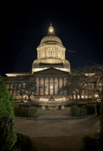 The south-facing entrance of the WA State Legislative Building at night during the second week of the 2026 WA State Legislative Session.