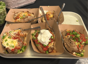 Tray of baked potatoes with fixings from WA Potato Day 2026.